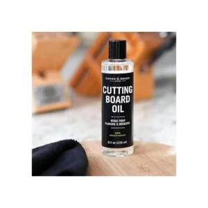 Caron Doucet Tabla de cortar y aceite de_2