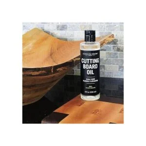 Caron Doucet Tabla de cortar y aceite de_4