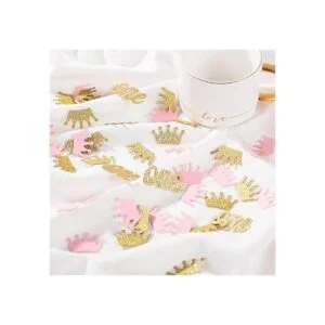 Confeti de corona con purpurina rosa y dorado una mesa de_3