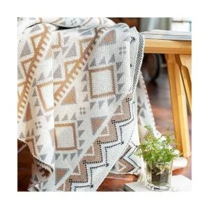 Manta bohemia de punto con borlas color marrón suave_2