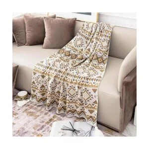 Manta bohemia de punto con borlas color marrón suave_5