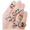 Honbay 24pcs esmalte aleación cráneo encantos colgantes