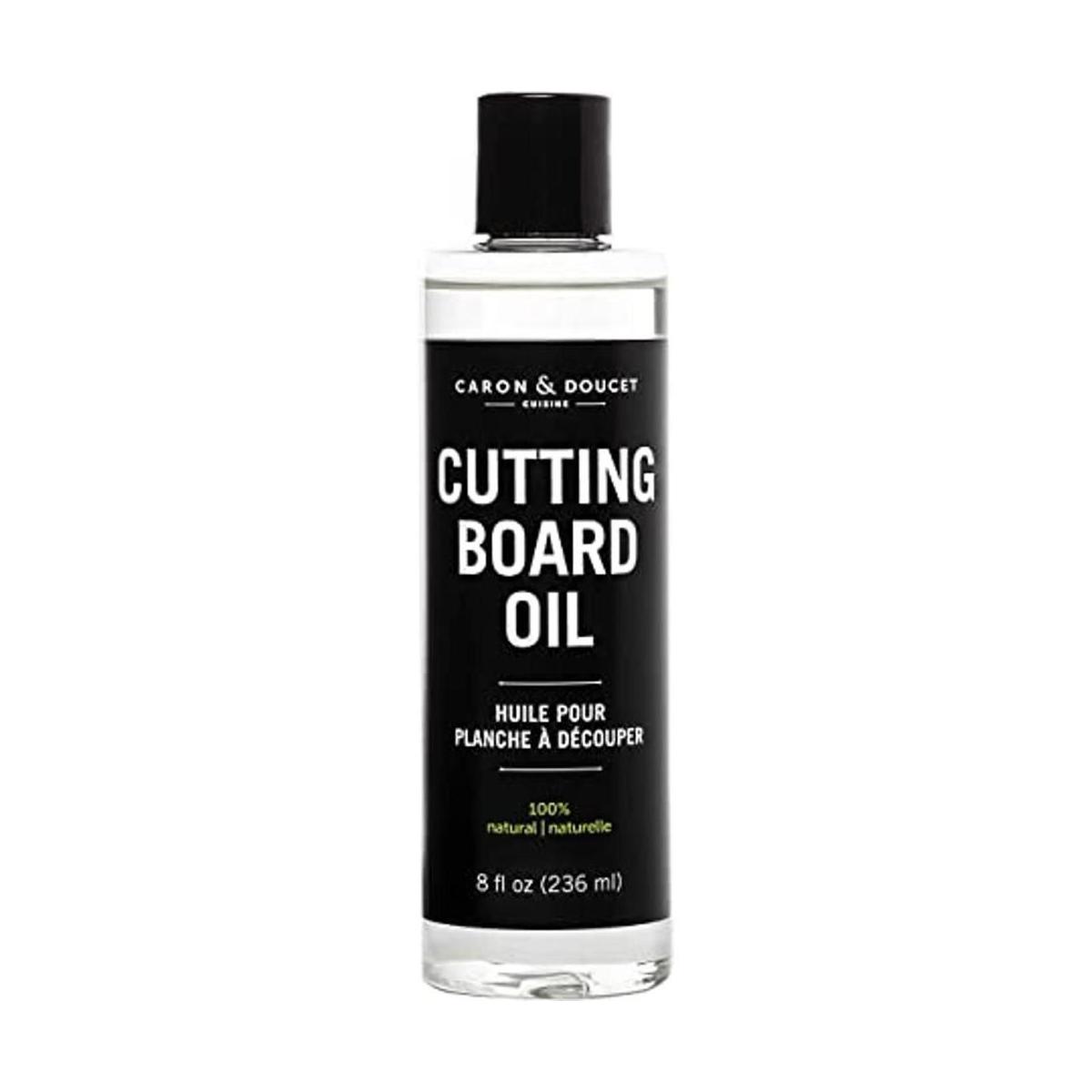 Caron Doucet Tabla de cortar y aceite de