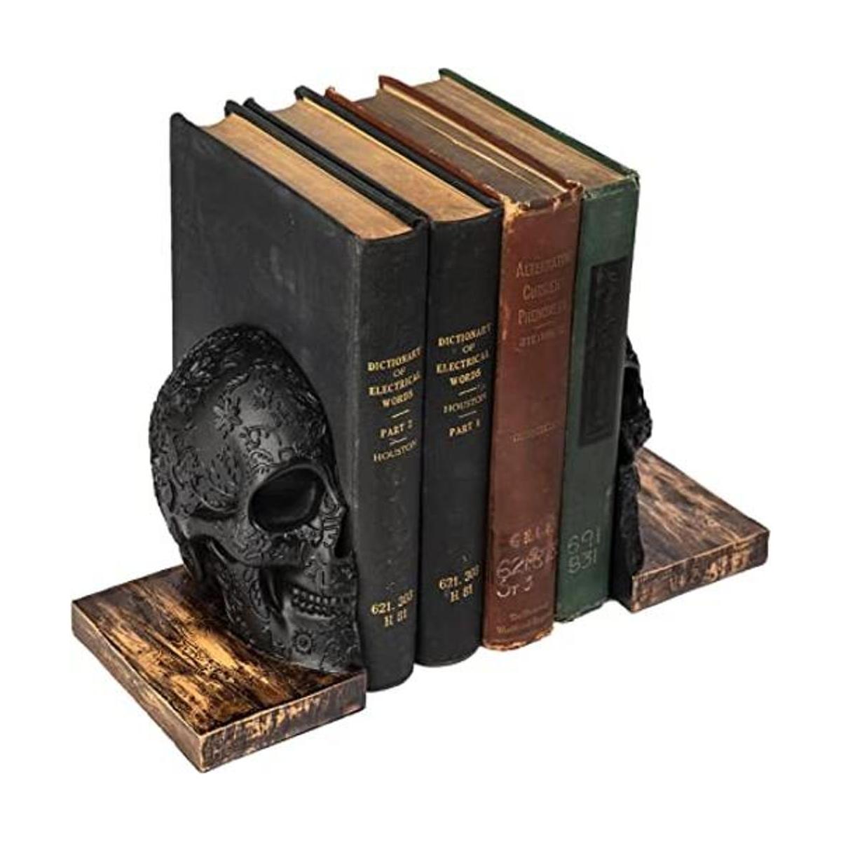 Sujetalibros de calavera góticos seres humanos de estilo