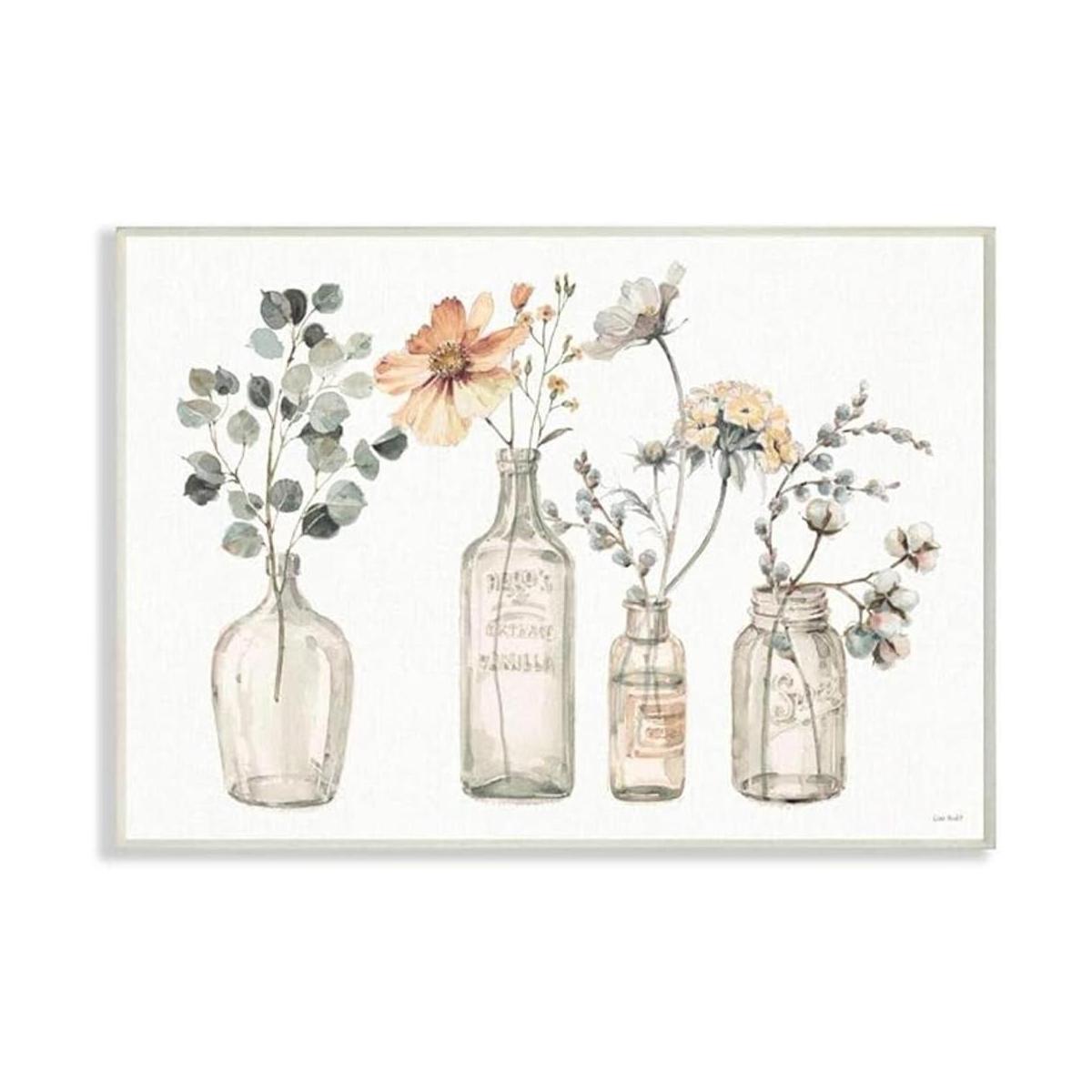 Ramos florales antiguos de flores en tarro de cristal