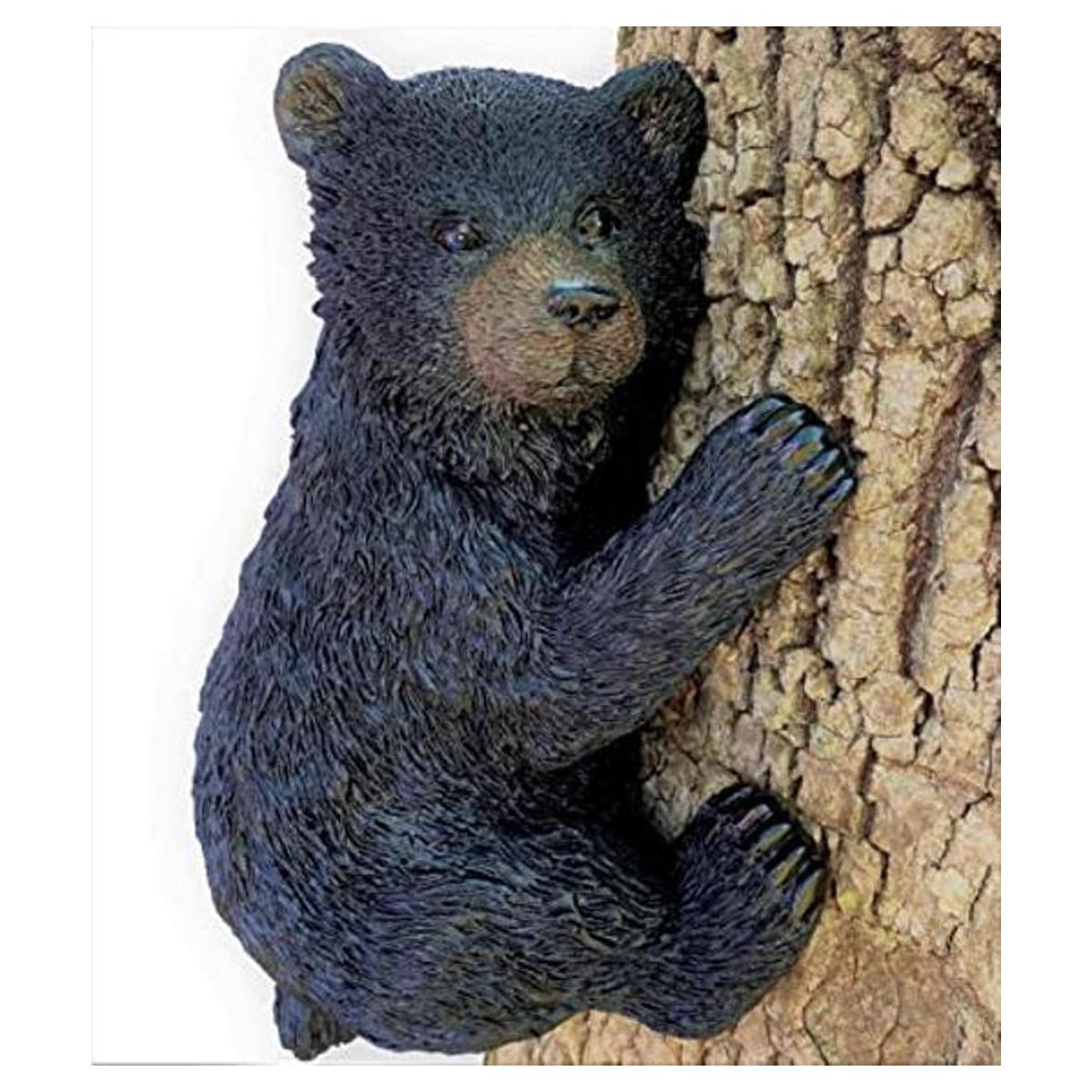Oso negro sobre un árbol decoración de jardín escultura
